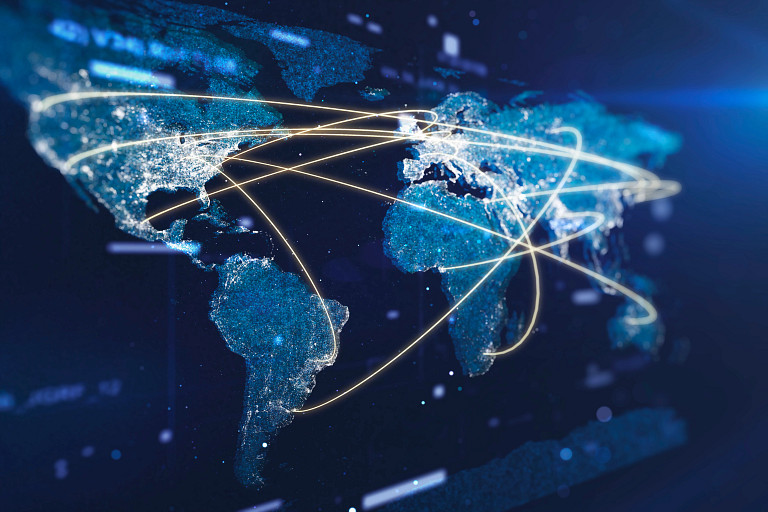 Digitized map of the world in blue, with golden lines connecting different parts of the map