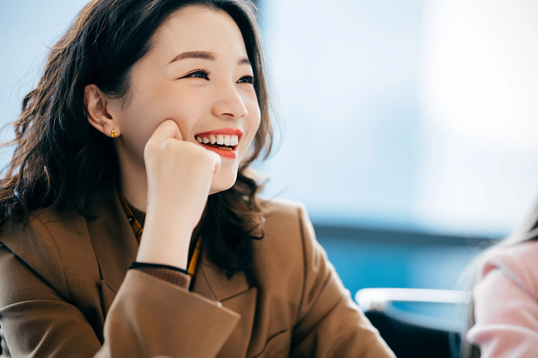 Asian Businesswomen in brown suit
