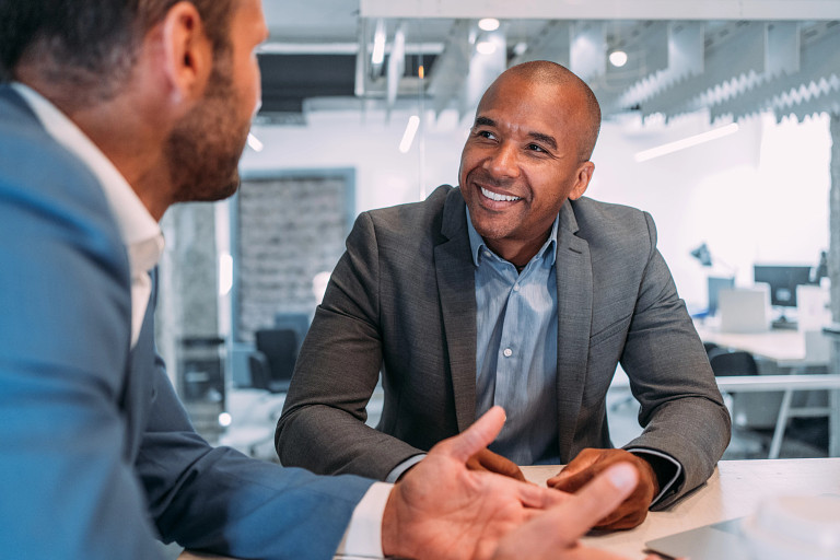 smiling business man in conversation